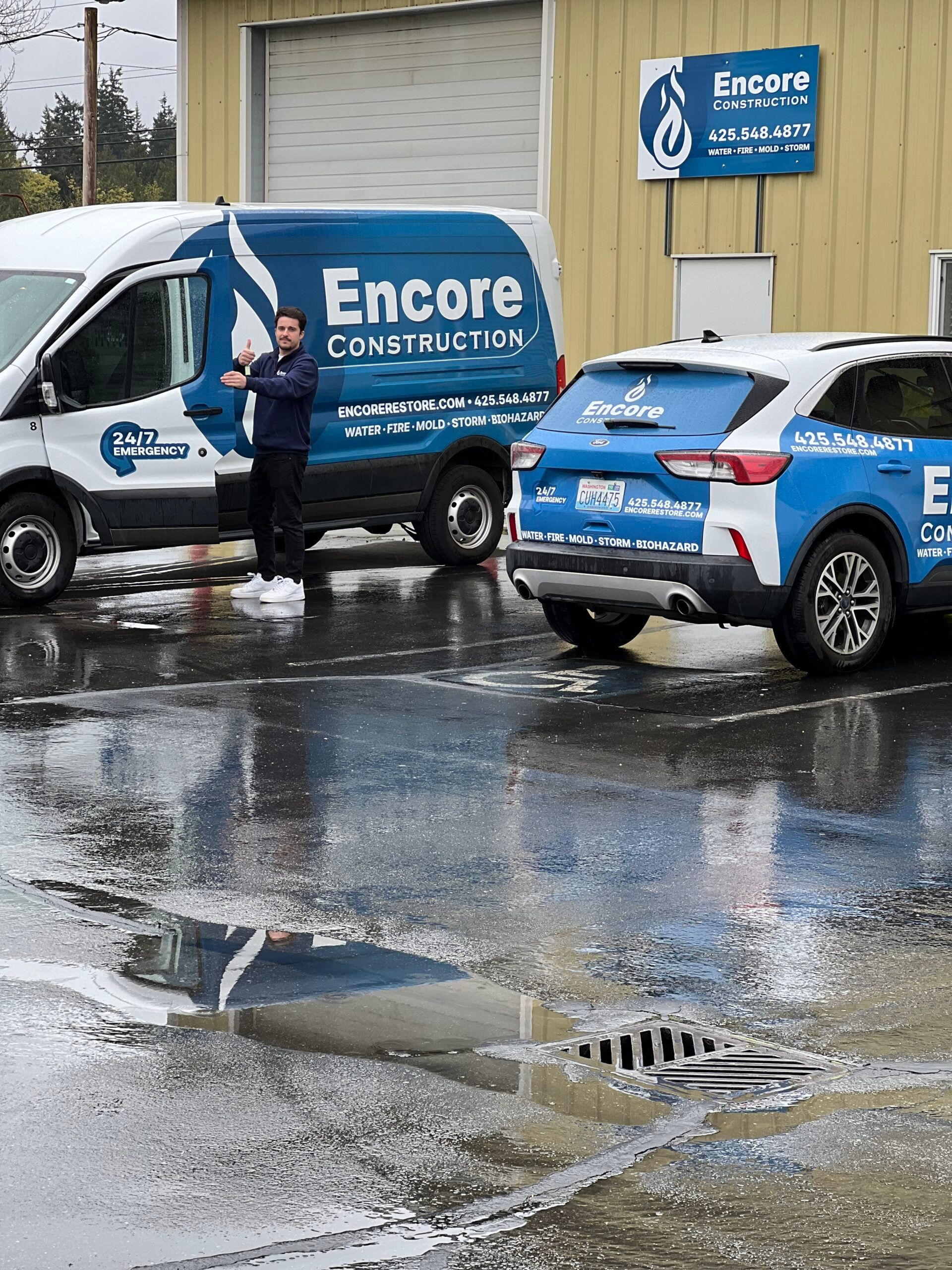 Encore Construction service vehicles parked outside the company facility