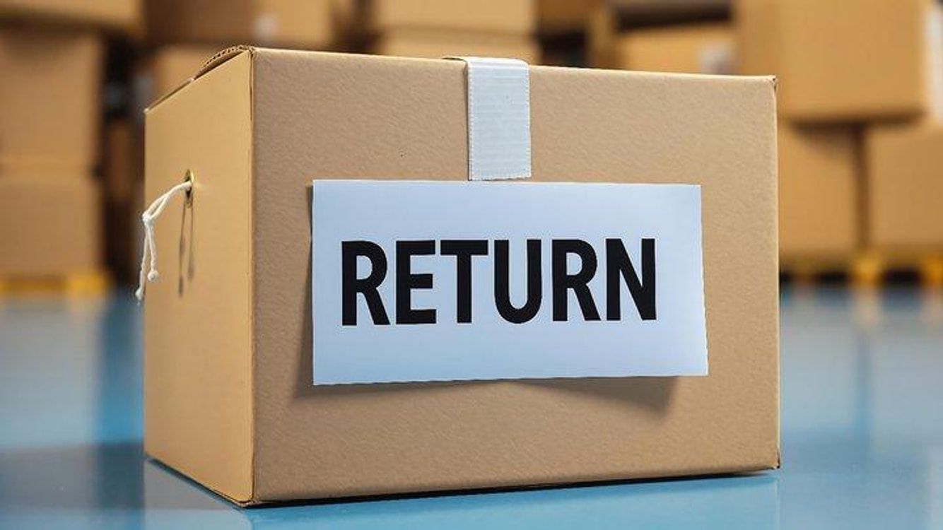 Sealed cardboard box labeled Return