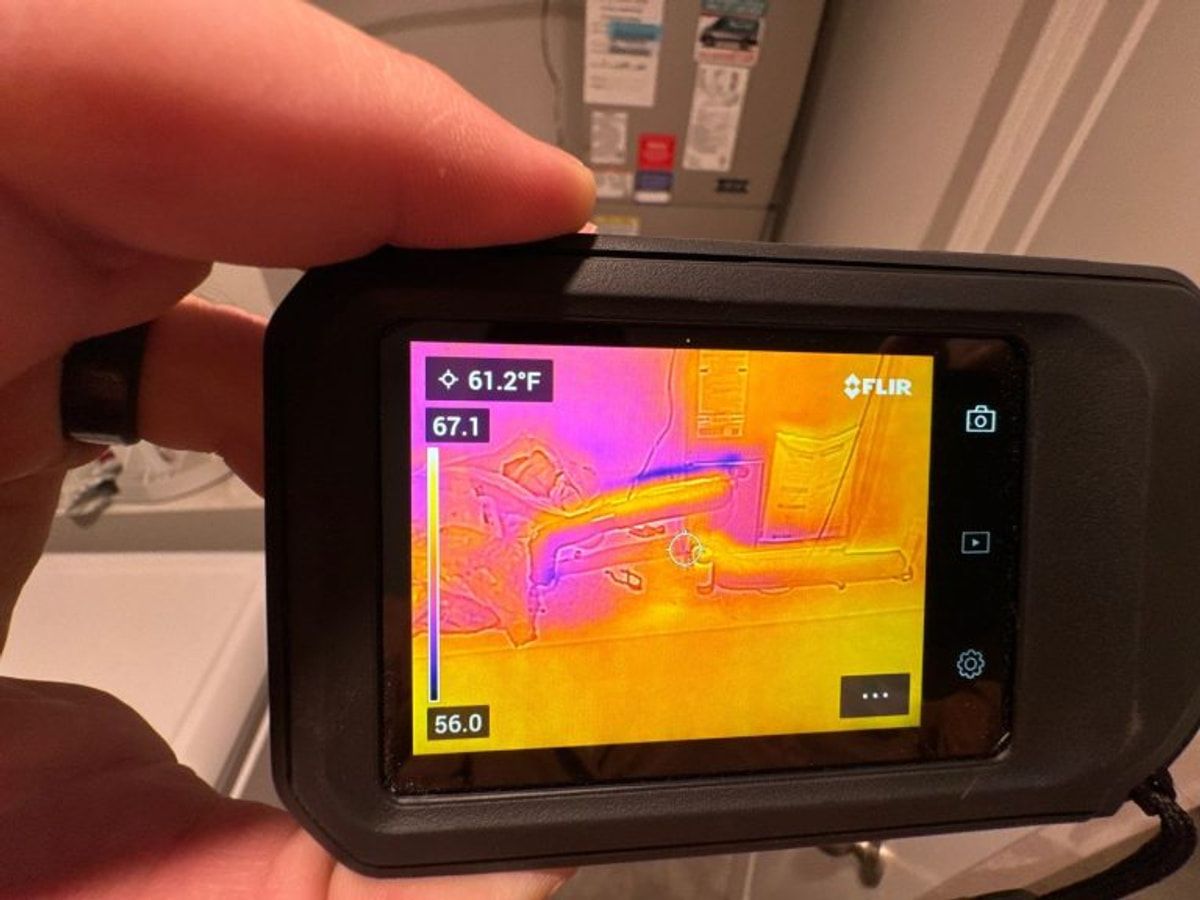 Thermal camera locating hidden moisture in an interior wall