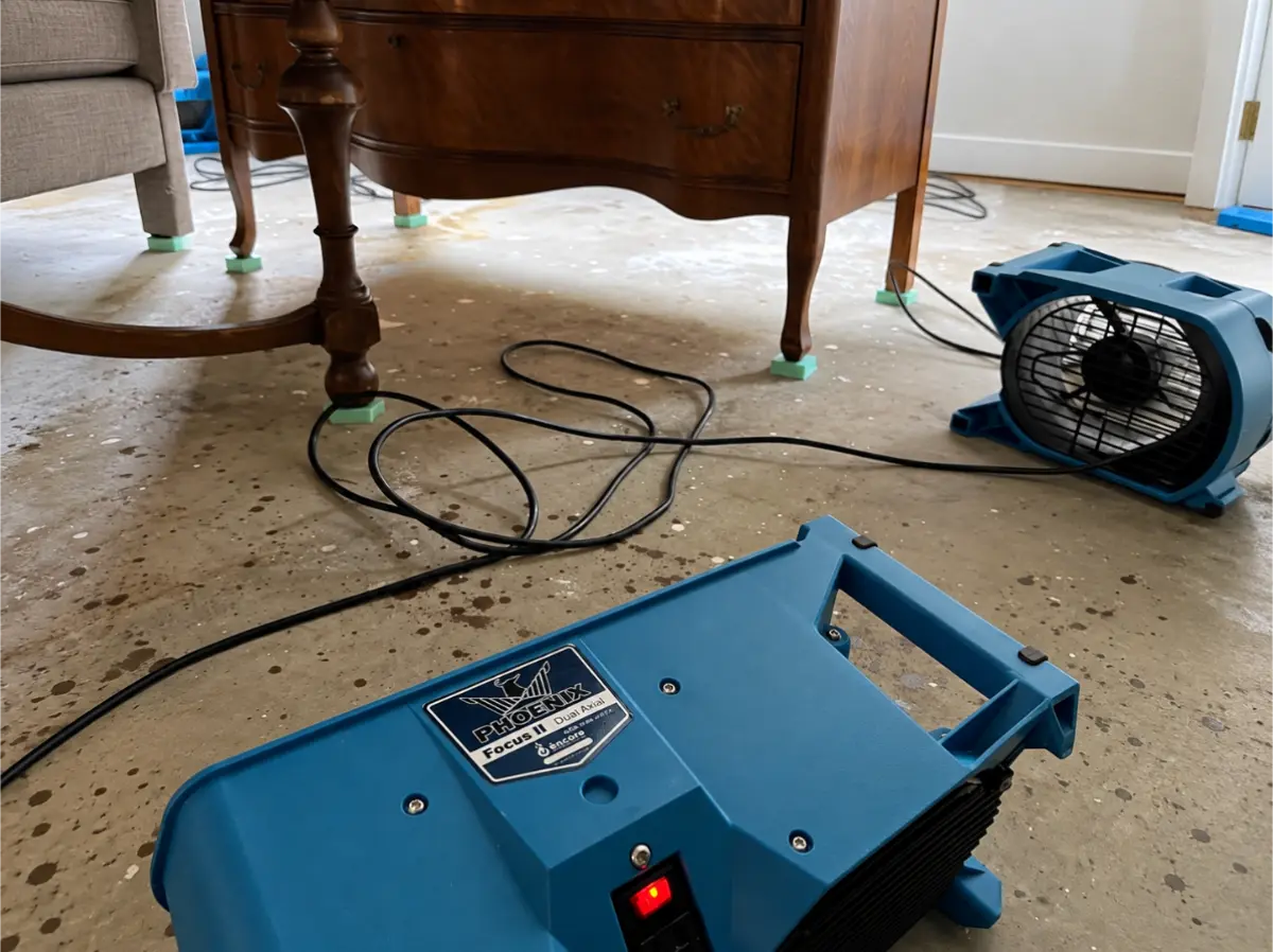 Phoenix air movers drying a residential floor after water damage.
